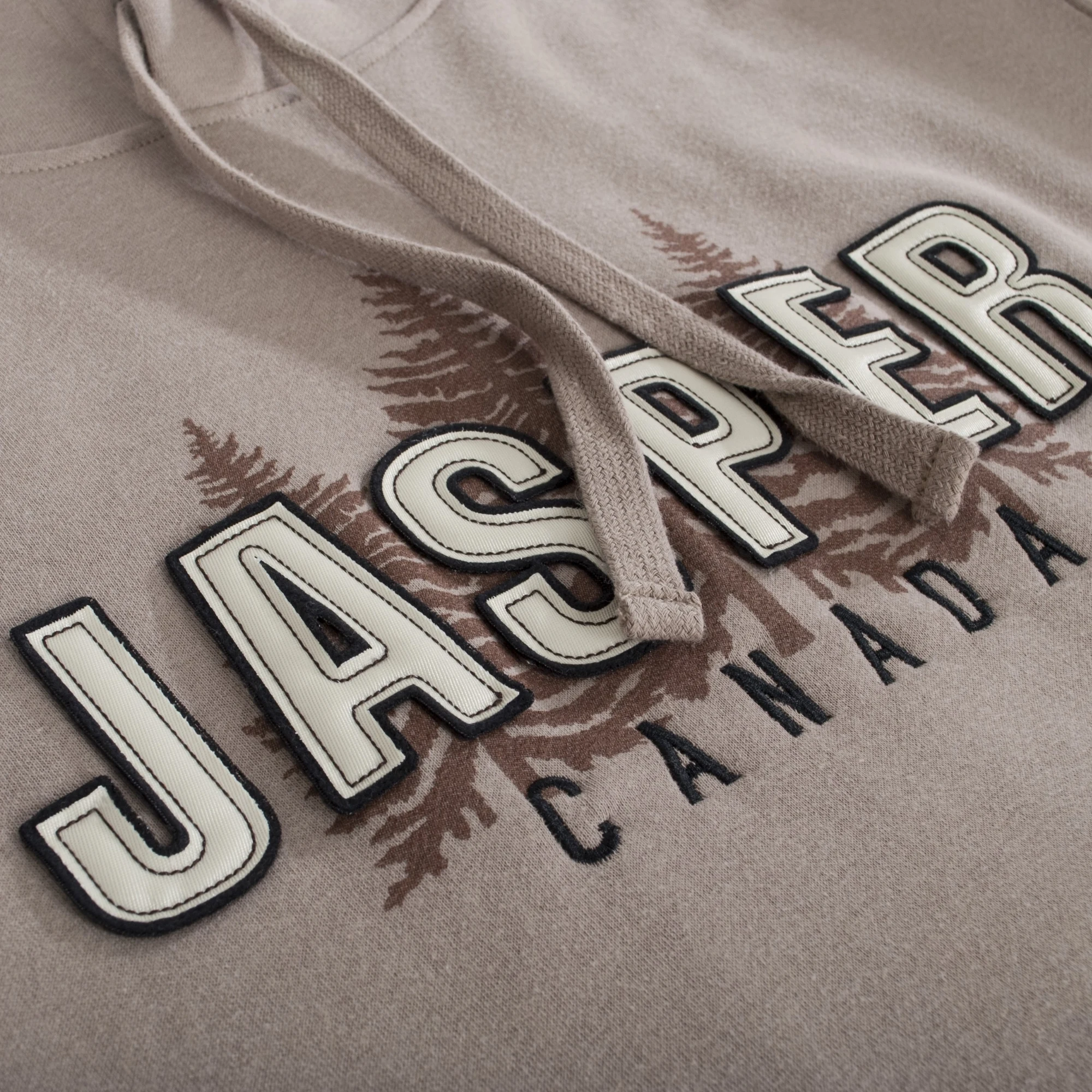 Lettrage Jasper Canada en appliqué sur un coton ouaté rouge
