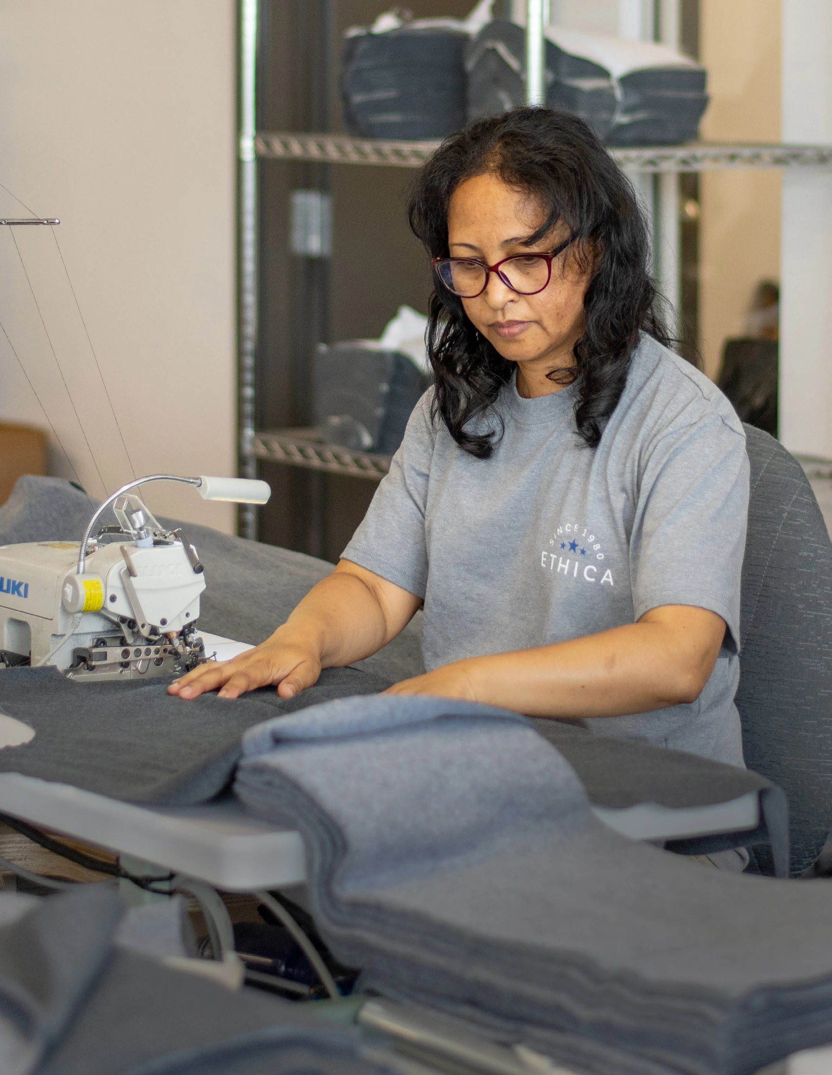 Employee sewing in the Montreal workshop.