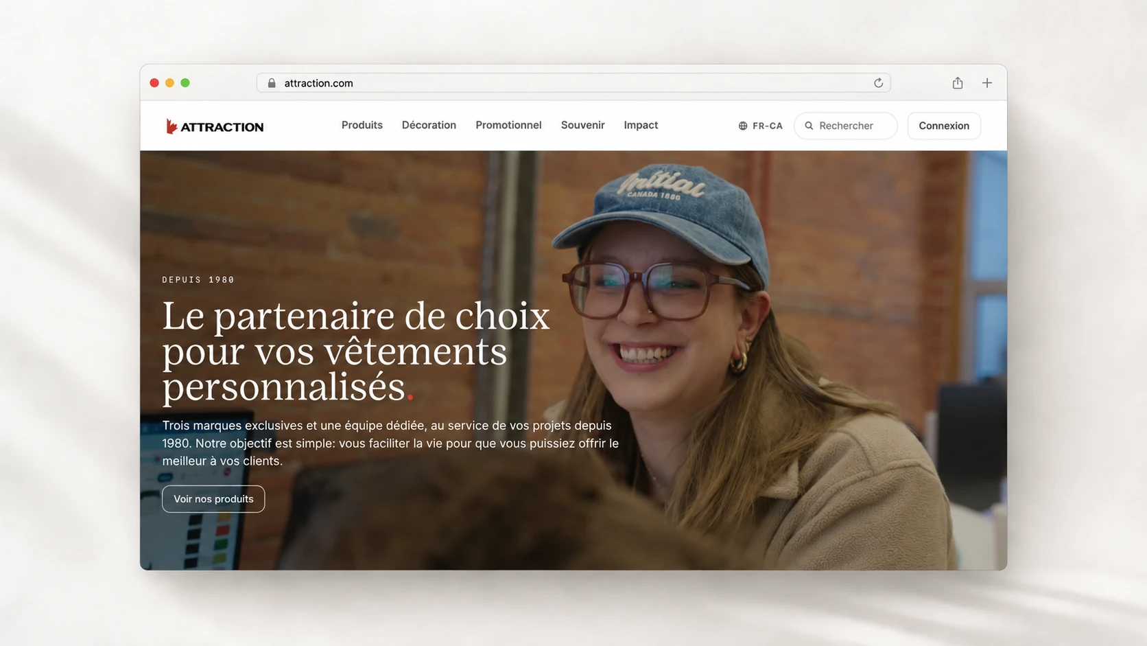 Attraction’s homepage in a browser window, with a smiling person in the video