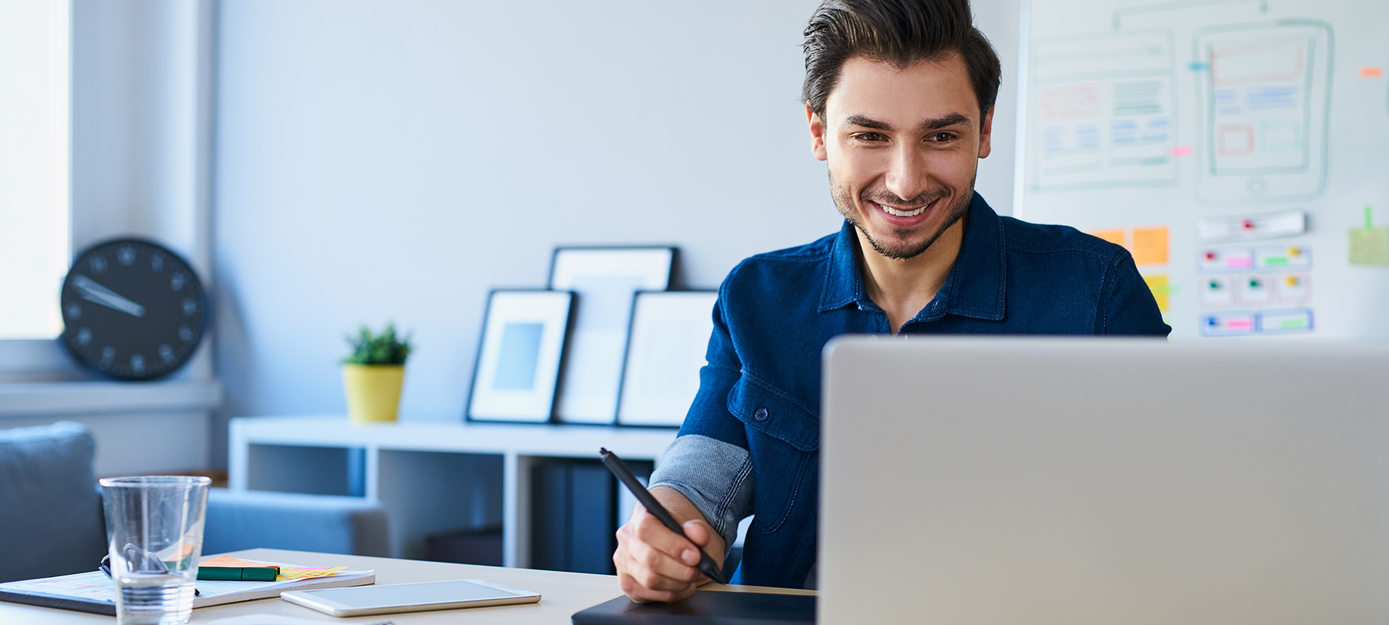 Graphic,Designer,Sketching,New,Project,On,Tablet,Working,With,Laptop